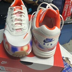 Nike Air Sneakers with Orange and Blue Accents